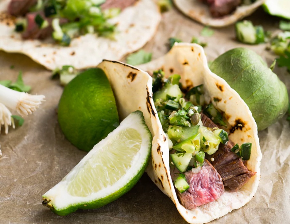 beef tacos with limes on the side